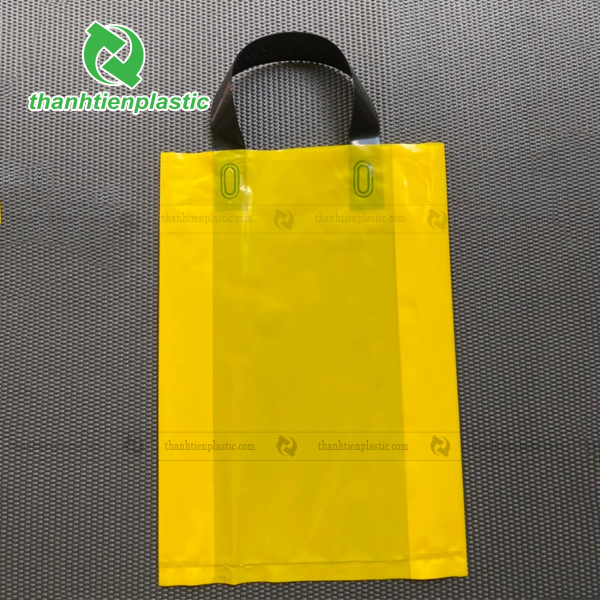 Mẫu túi ép quai trơn màu vàng quai đen